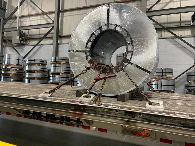 Steel coil chained eye to the side on a Fission flatbed