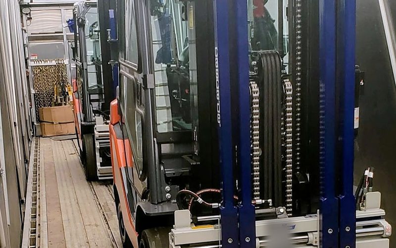 Forklifts loaded inside a Fission Conestoga