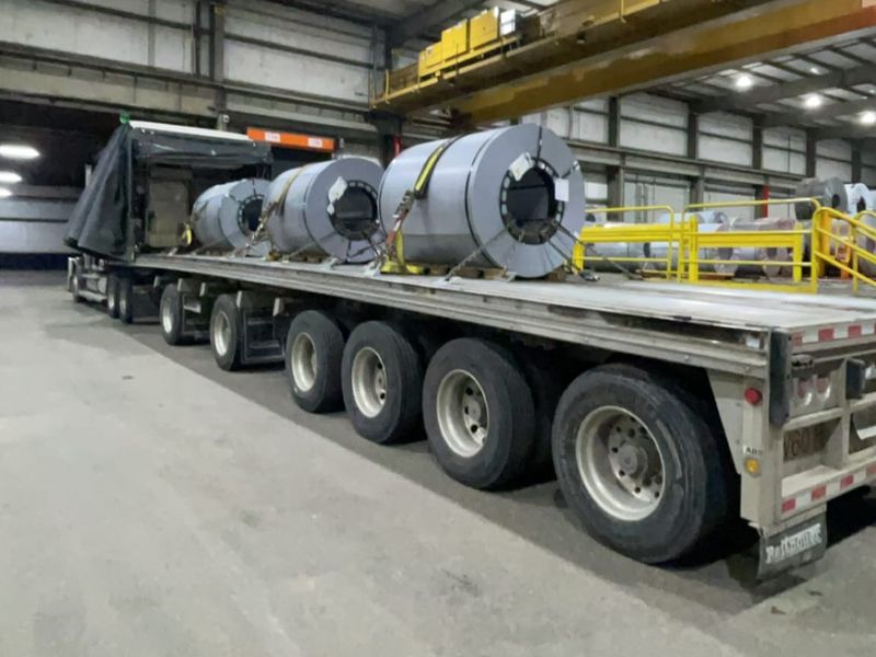 Fission trailer loaded with steel coils inside a plant